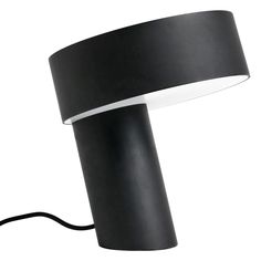 a black lamp with a white light on it