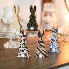 small wooden animal figurines sitting on top of a table