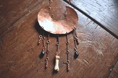 Vintage hammered copper crescent moon necklace with black spinel, copper beads, and a coyote toe bone. Find pieces like this and more at http://www.deadthingsbysarah.com! Crescent Moon Necklace, Black Spinel, Hammered Copper, Moon Necklace