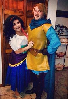 a man and woman dressed up as peter panto and merida from disney's beauty and the beast