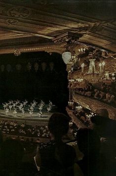 an audience watching a performance on stage