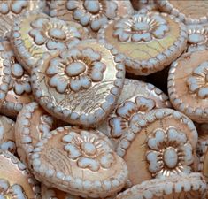 some very pretty looking cookies that are in the shape of flowers and circles on top of each other