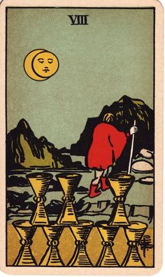 a tarot card with a woman in red on the front and yellow on the back