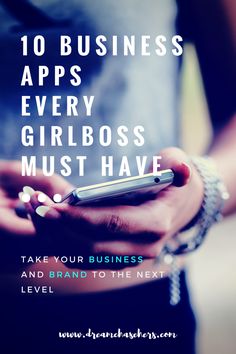 a person holding a cell phone with the text 10 business apps every girl boss must have