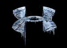 the letter h is made up of ice and icicles on a black background,