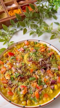 a bowl filled with soup and vegetables on top of a table