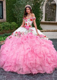 Look breathtaking in this floral applique long sweetheart dress with A-line ruffled skirt by Rachel Allan RQ5007. This quinceañera gown is a vibrant spectacle of color and grandeur. The gown features a stunning contrast of color with a beautifully embroidered bodice that includes floral motifs in vivid hues. The off-the-shoulder neckline adds a classic and elegant touch, while the voluminous skirt is crafted from layers of cascading ruffles, creating a dramatic and eye-catching effect. This dres Dama Dresses Quinceanera, 1500 Dresses, Quince Dresses Charro, Mexican Quinceanera Dresses, Charro Quinceanera Dresses, Quinceñera Dresses, Dama Dresses, Military Ball Dresses, Pretty Quinceanera Dresses