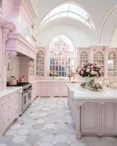 a large kitchen with pink cabinets and white counter tops