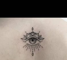 an all seeing eye tattoo on the back