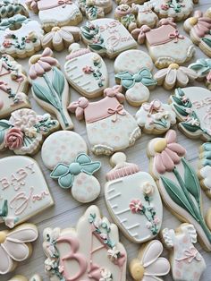 many decorated cookies sitting on top of a table