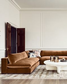 a living room with two couches and a coffee table in the middle of it