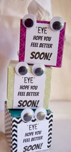 three stacked boxes that have different types of cards on top of each other, with the words eye hope you feel better soon