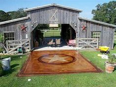 a barn with a star painted on the floor