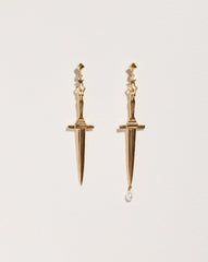 Our classic dagger earrings in yellow gold plate over sterling silver with sculptural handles and a single dangling pearl droplet. SIZE & MATERIALS   Composition: 14k yellow gold plate over sterling silver, freshwater pearl droplet Measurements: dagger length: 2"  Read about how to care for our jewelry here.   collections Dagger Earrings - Gold Earrings - Pearl Earrings - Drop Earrings - Pearl Jewelry - Gold Jewelry - 14k Gold Jewelry - Fashion Earrings - Dagger Jewelry - Gold Plate Jewelry Mens Choker, Earrings Gold Pearl, Dagger Earrings, Spike Earrings, Pamela Love, Gold Piece, Earrings Drop, Gold Pearl, Piercing Jewelry