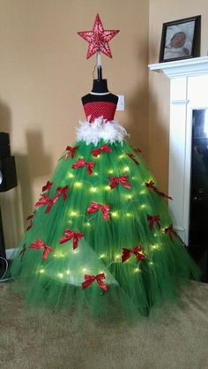 a green tulle skirt with red bows and lights