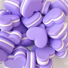 purple and white heart shaped cookies on a plate