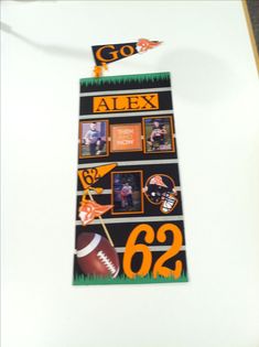 an orange and black banner with footballs on it that says go alex, 22