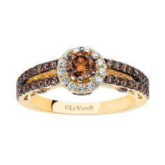 a brown and white diamond ring on top of a yellow gold band with the words le vian bridal