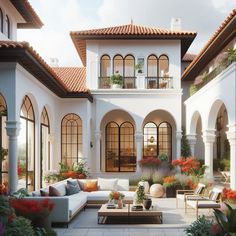 an outdoor living area with couches, tables and potted plants on the patio