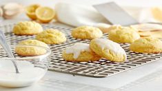 lemon cookies with icing on a cooling rack