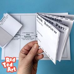 someone is holding up some papers with the words red ted art on them