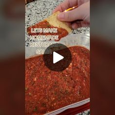 someone is making homemade pizza sauce in a plastic container