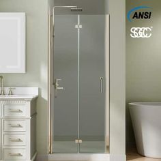 a bathroom with a glass shower door next to a sink and bathtub in it