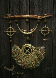 a wooden door with some decorations hanging from it's sides and an arrow on the side