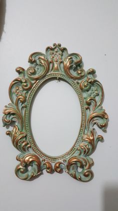 an ornate mirror hanging on the wall