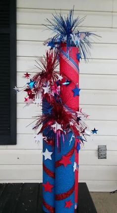 a red, white and blue firecracker with stars on it