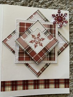 a close up of a piece of paper with a snowflake design on it