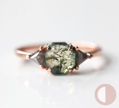 Moss agate & salt pepper diamond engagement ring with a simple three-stone geometric setting. Rustic hexagon or octagon-cut green gemstone ring with accent grey diamond triangles, pictured here in rose gold. The prices listed are for the moss agate ring only. Please see the set here: https://www.etsy.com/listing/965328699/ And the plain curved band here: https://www.etsy.com/listing/654582518/ We are the original jewelry designers to use moss agate and create geometric moss agate one-of-a-kind j Engagement Rings Moss, Engagement Rings Moss Agate, Agate Wedding Ring, Hexagonal Ring, Pepper Diamond Ring, Salt Pepper Diamond, Green Gemstone Ring, Agate Engagement Ring, Moss Agate Ring