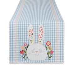 a blue and white checkered table cloth with an image of a bunny