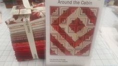 there are many quilts on display in the store