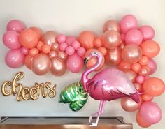 a pink flamingo balloon and some balloons