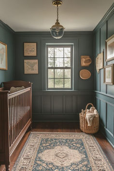 a baby's room with a crib, rug and pictures on the wall