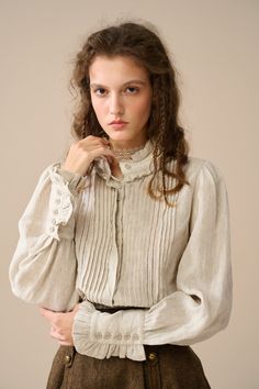 Linennaive's linen blouse is perfect for adding a touch of vintage-inspired romance to your outfit. Crafted from soft linen, the delicate ruffles at the neckline and cuffs elevate its texture and add a soft and romantic feel.  Softly pleated detailing creates a flattering silhouette on this blouse that's sure to stand out. Experience the epitome of elegance and grace with this Linen Blouse. 【Fabric】 100% linen- 200g/gram. Medium weight 【Size】 Based on approximate body measurements. *SIZE XS (US 0-2 | UK/AU 4-6 | DE 32-34 | FR 34-36 | IT 38-40 | RU 40-42 | JP 7-9) bust: 32.5"-33.5" / 81-85 cm *SIZE S (US 4-6 | UK/AU 8-10 | DE 34-36 | FR 36-38 | IT 40-42 | RU 42-44 | JP 9-11) bust: 34.5"-35.5" / 87-90 cm *SIZE M (US 8-10 | UK/AU 12-14 | DE 38-40 | FR 40-42 | IT 44-46 | RU 46-48 | JP 13-15) b Elegant Linen Tops With Buttons, Vintage Linen Blouse For Fall, Elegant Fitted Linen Blouse, Elegant Long Sleeve Linen Blouse, Elegant Pintucks Blouse For Fall, Elegant Fall Blouse With Pintucks, Vintage Long Sleeve Linen Blouse, Vintage Linen Long Sleeve Blouse, Vintage Beige Linen Blouse