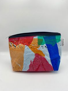 a multicolored pouch with zipper