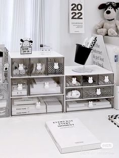 a white table topped with lots of drawers