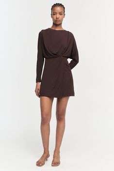 PRE-FALL 2024 WOMEN'S COLLECTION The Tasha Dress in Espresso. This mini features an elegant, draped design that cascades across the body in soft folds, highlighted by the dress's long sleeves and cinched waist. This piece combines the comfort of a soft, flowing fabric with the polished finish of meticulous tailoring, embodying a blend of classic style and modern flair. Cinched Dresses, Brown Long Sleeve Mini Dress For Date Night, Brown Long Sleeve Mini Dress, Fitted Brown Mini Dress With Button Closure, Fitted Brown Long Sleeve Mini Dress, Brown Long Sleeve Mini Dress With Buttons, January Jones, Designer Drapes, Cinched Waist