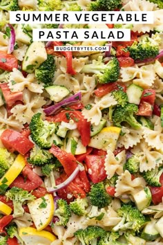 pasta salad with tomatoes, broccoli and red onions in a white bowl text overlay reads summer vegetable pasta