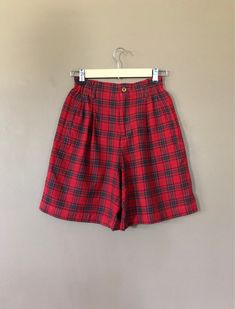 "Ultra high waisted 90's plaid shorts. Classic 90's red plaid pattern. Pleated accents in front with two front pockets and one back pocket. Shorts are in excellent clean condition. Very soft wool~rayon blend fabric. Measurements are taken zipped or buttoned up and laid comfortably flat then x 2 for total circumference (inches) Lizsport Tag Size 4 Waist 24~26\" stretch Hips 38\" Length 18.5\" Inseam 8\" Rise 12\" Bottom leg Opening Circumference 25.5\" All items are free of rips, tears, holes, an Fitted Plaid Casual Shorts, Fitted Casual Plaid Shorts, Plaid Bottoms With Built-in Shorts, High-waisted Plaid Bottoms With Built-in Shorts, Plaid High Waist Cotton Shorts, High Waist Plaid Cotton Shorts, Vintage Plaid Bottoms For Summer, Vintage Plaid Summer Bottoms, Vintage High Waist Plaid Bottoms