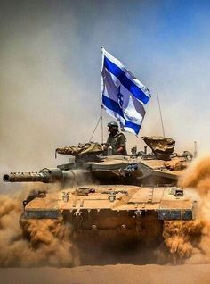 a tank driving through the desert with a flag on top