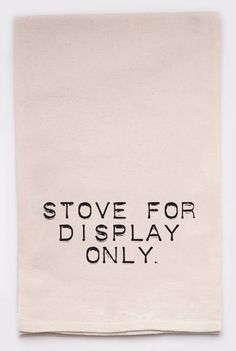 a tea towel with the words stove for display only printed in black on it