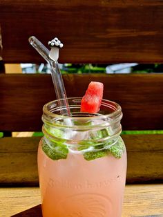 a mason jar filled with watermelon and ice