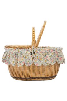 a wicker basket with floral fabric on it