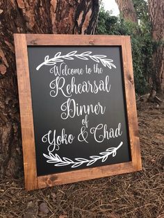 a chalkboard sign that says welcome to the rehearsal dinner yoho and chad