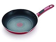 a red and black frying pan on a white background