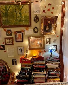 a room filled with lots of books and pictures on the wall