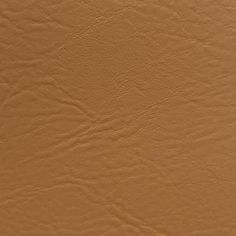 an orange leather texture background or wallpaper that looks like it has been painted in different shades